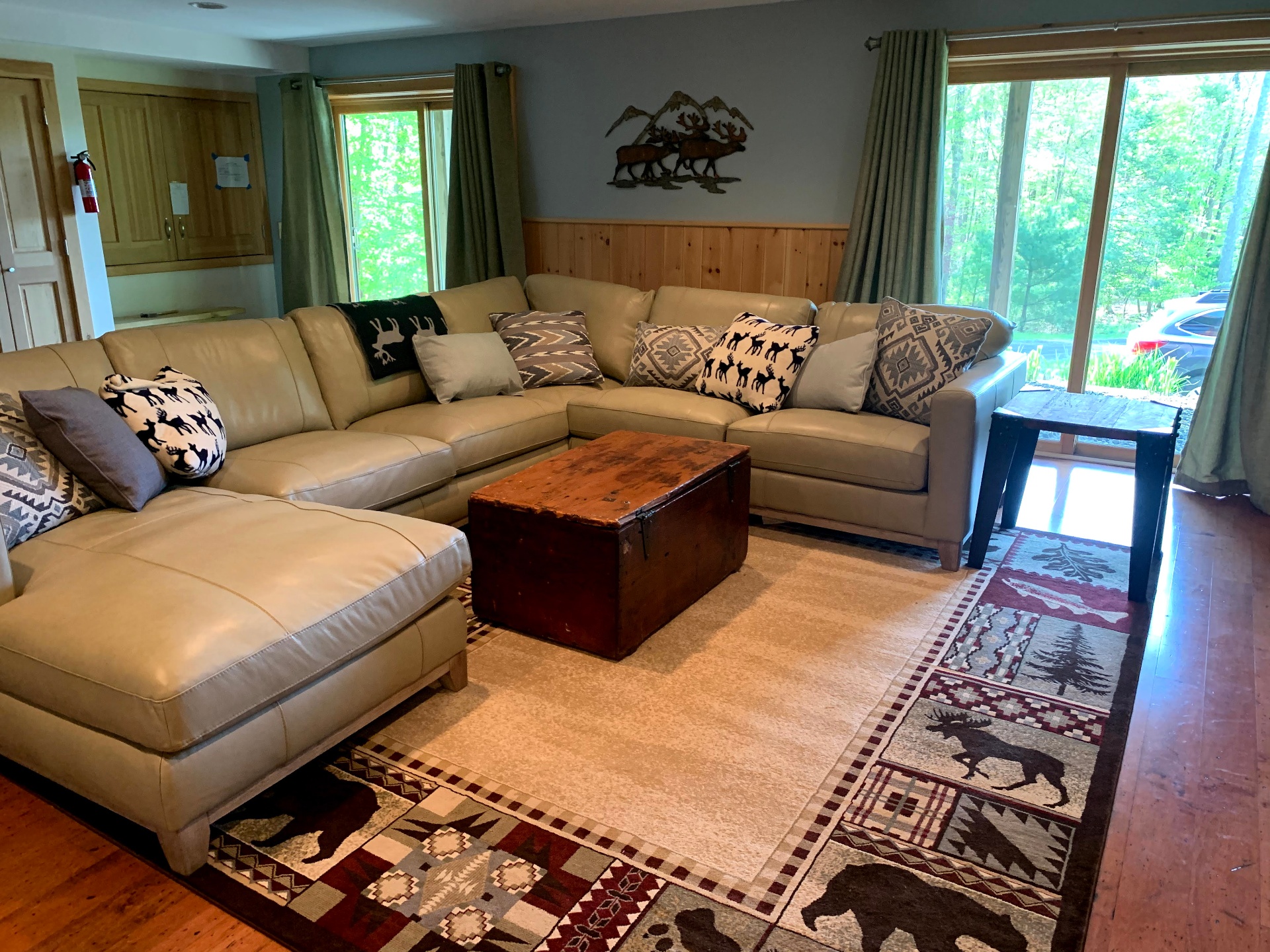 Downstairs sectional with cabin decor