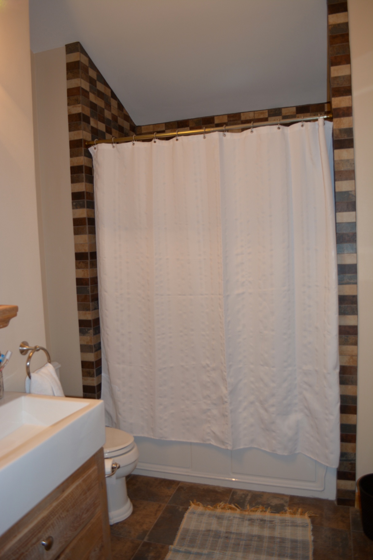 Bathroom with mosaic tile surround