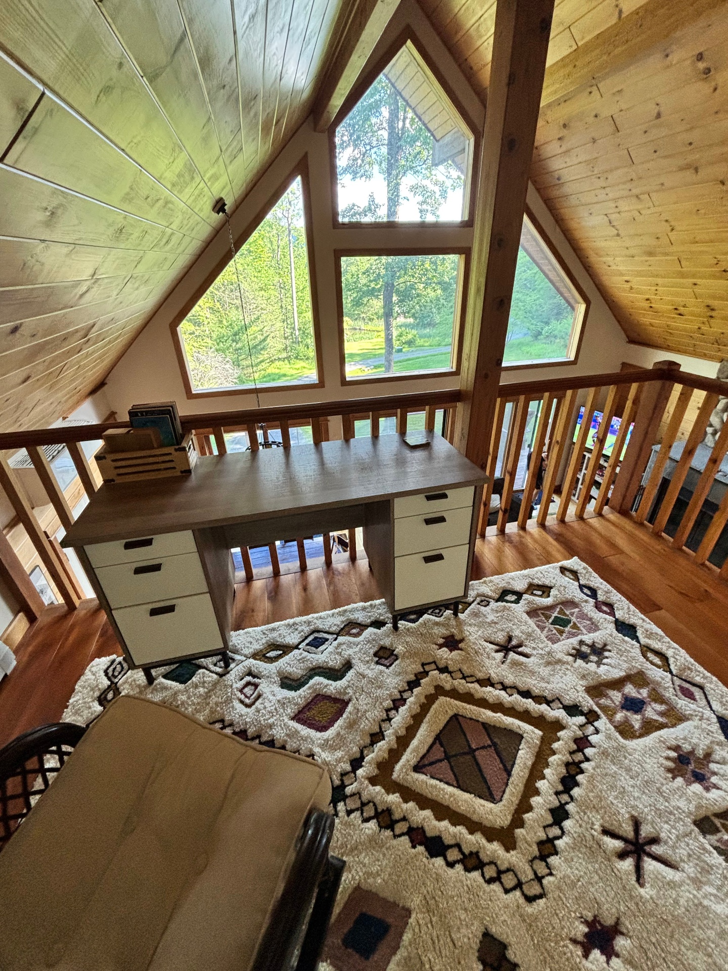 Loft desk with tall A-frame windows