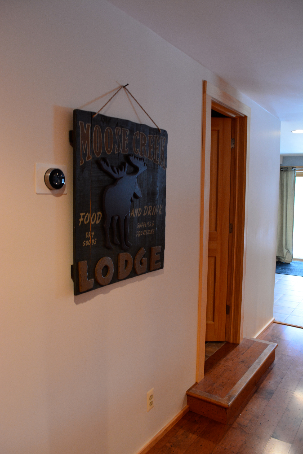 Moose Creek Lodge cabin sign in the hallway