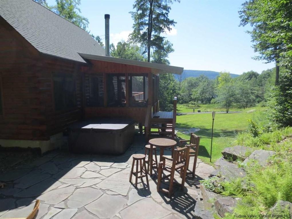 Hot tub and flagstone patio with mountain views