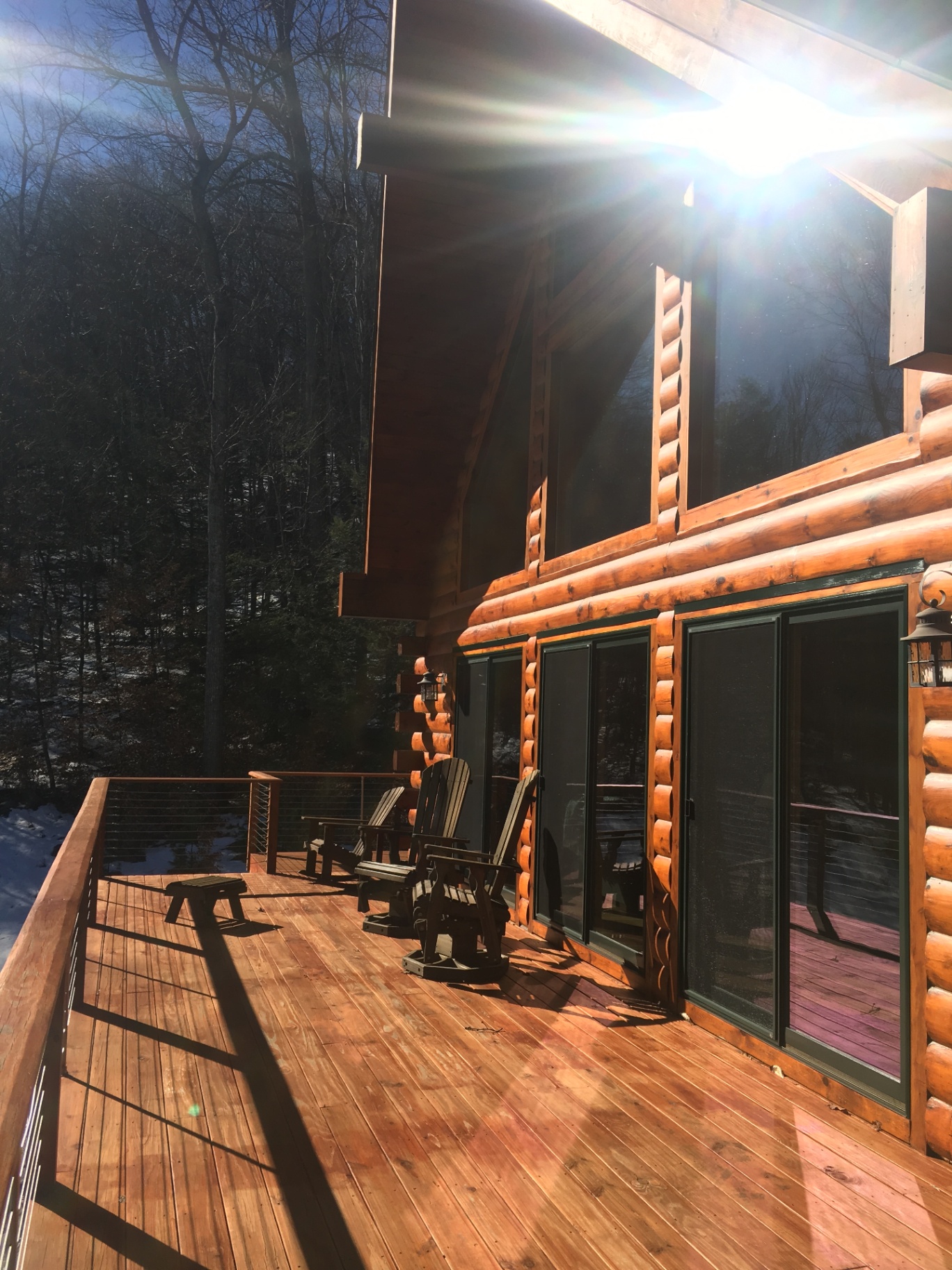 Sunlit wraparound deck in winter